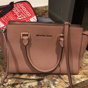 Michael Kors tan leather purse.